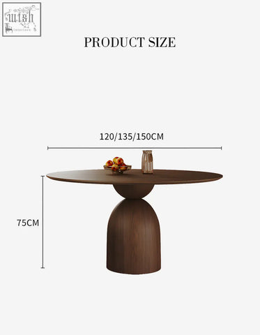 Amaia round pedestal dining table in black solid wood with a modern sculptural round base perfect for dining rooms