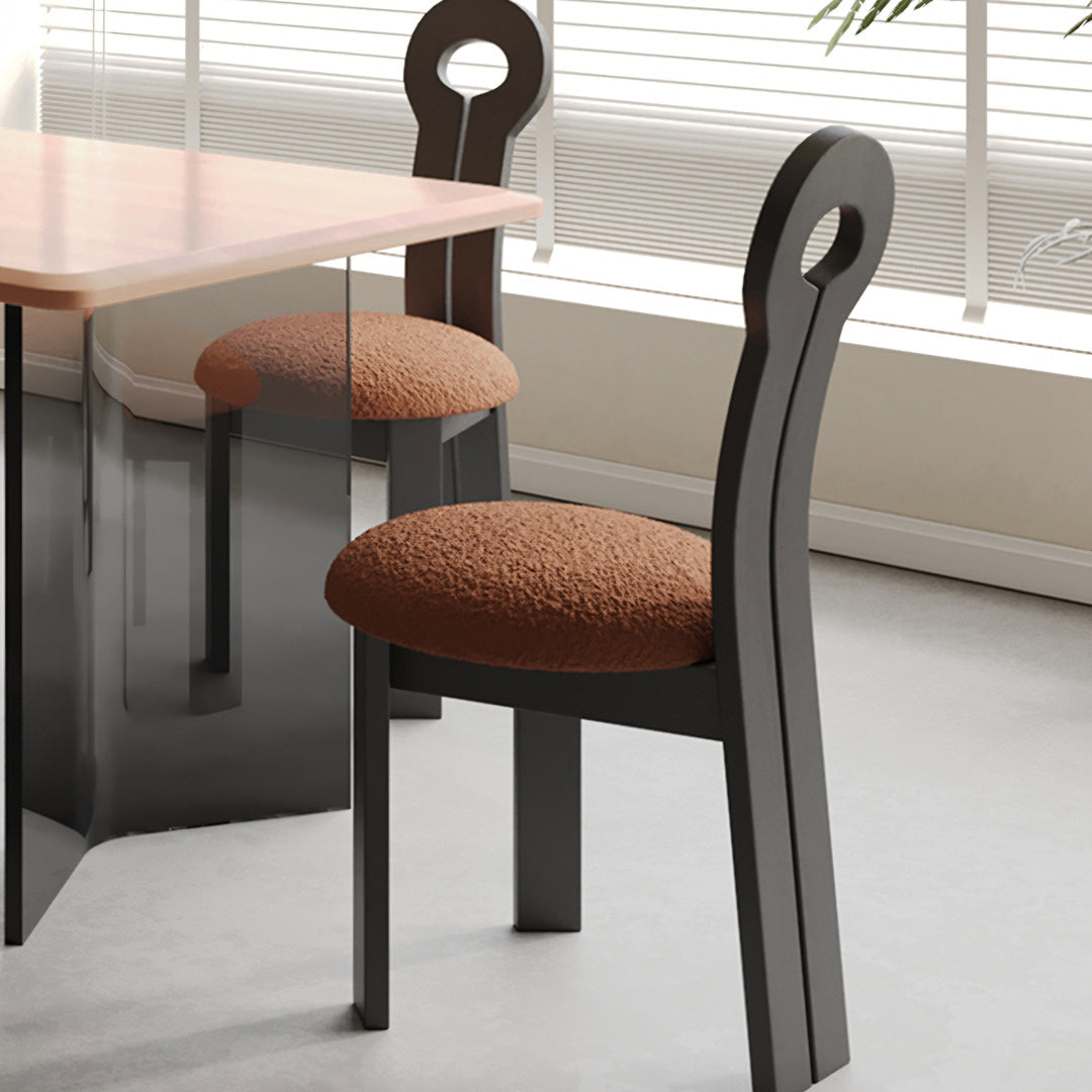 Black amaris dining chair with boucle textured brown cushion and looped back design perfect for dining room
