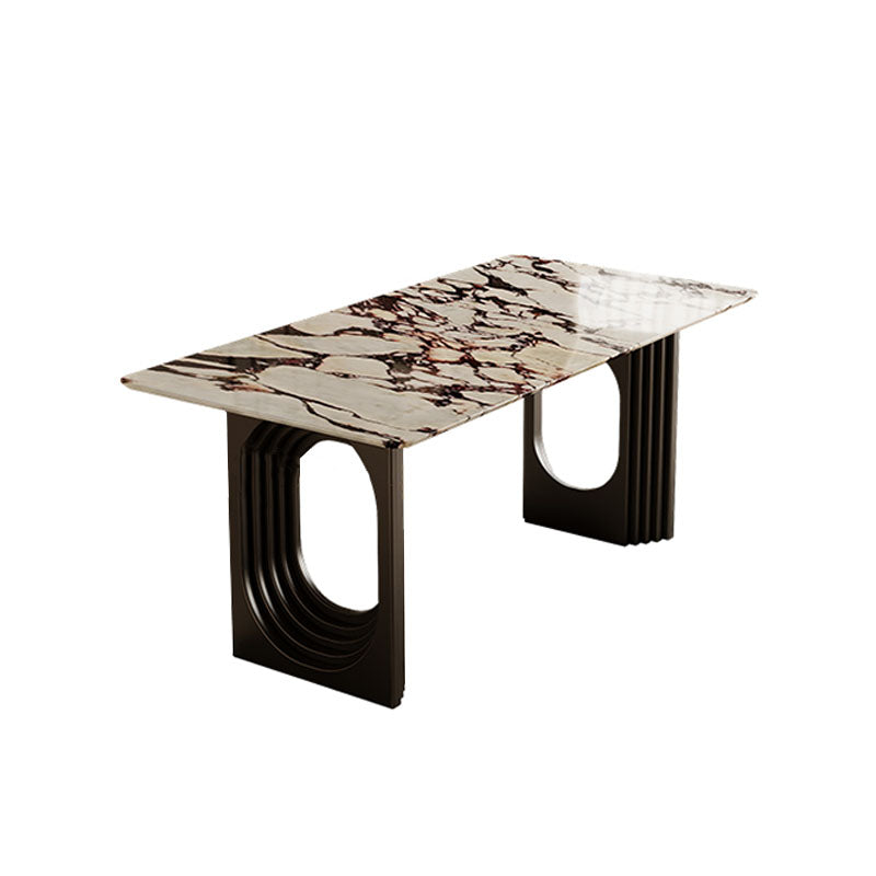Modern amaris dining table with polished white and brown marble top and sleek black metal legs with oval cutouts