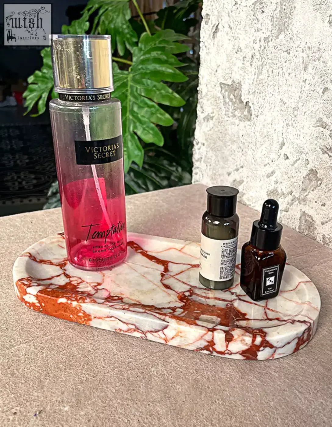 Amaryllis marble tray with sleek design and white reddish brown veined pattern holding beauty products and shipping cost info