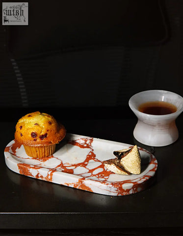 Amaryllis marble tray in white and orange with sleek elongated oval shape perfect for serving and offer financing