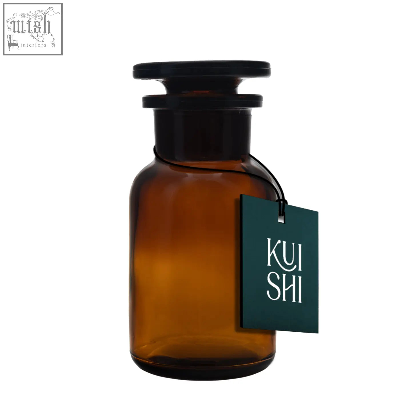 A sleek amber glass apothecary jar with black lid and dark green kui shi tag perfect for glass apothecary jars collection