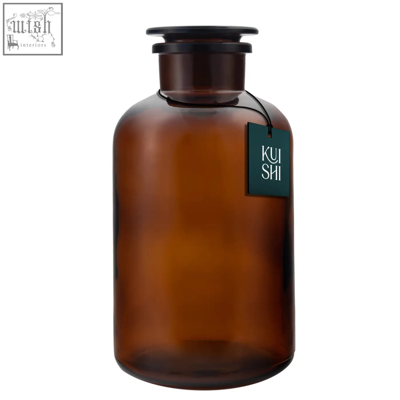 A sleek amber glass apothecary jar with a black lid and dark green kui shi tag perfect for stylish storage