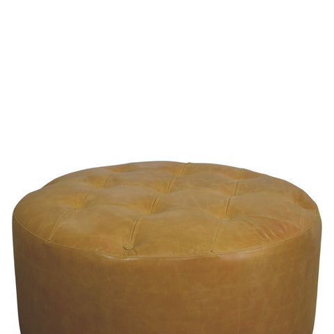 Tan leather ottoman with a tufted top as part of the amber oak leather coffee table collection
