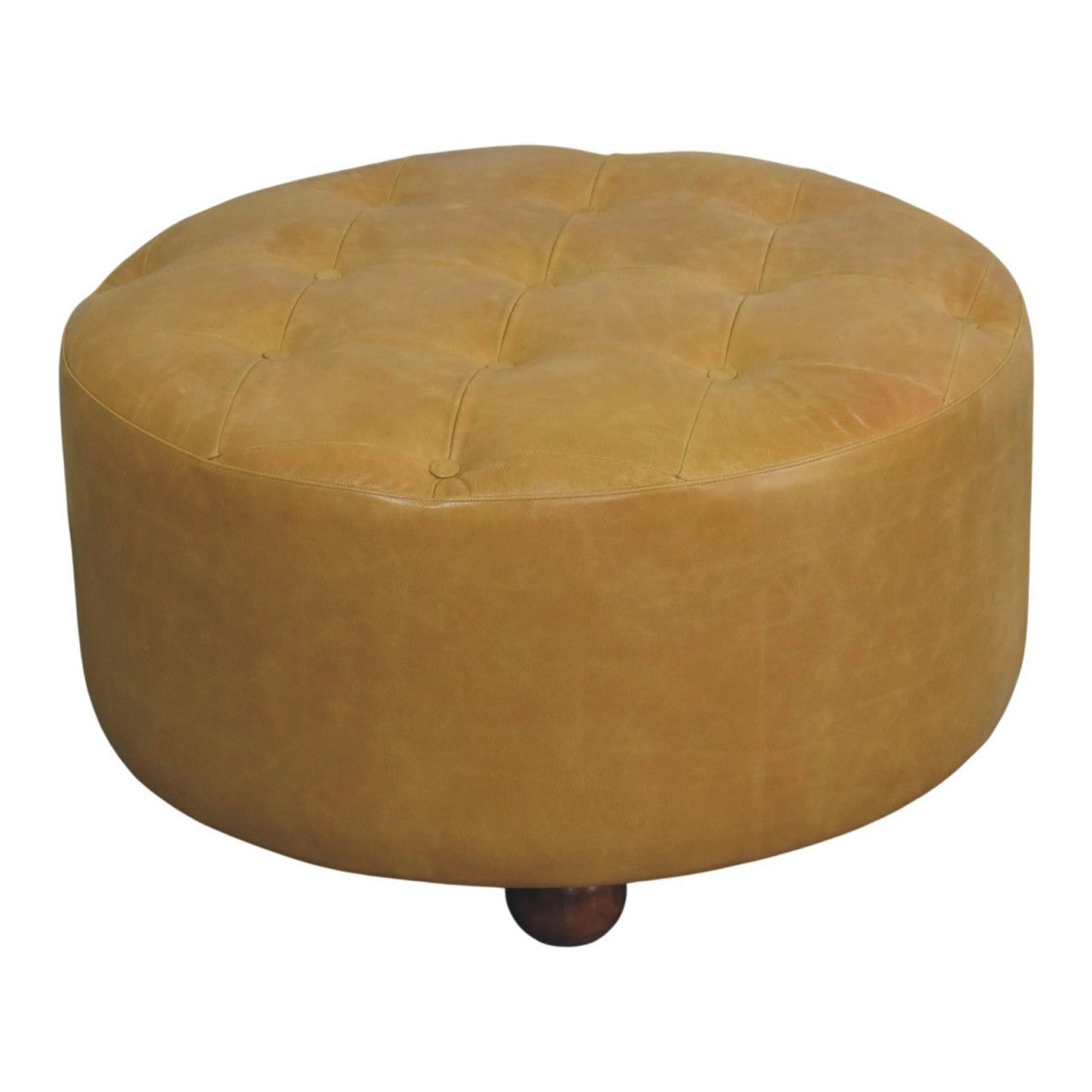 Tan leather tufted ottoman with round cushioned top and wooden legs in amber oak leather coffee table style