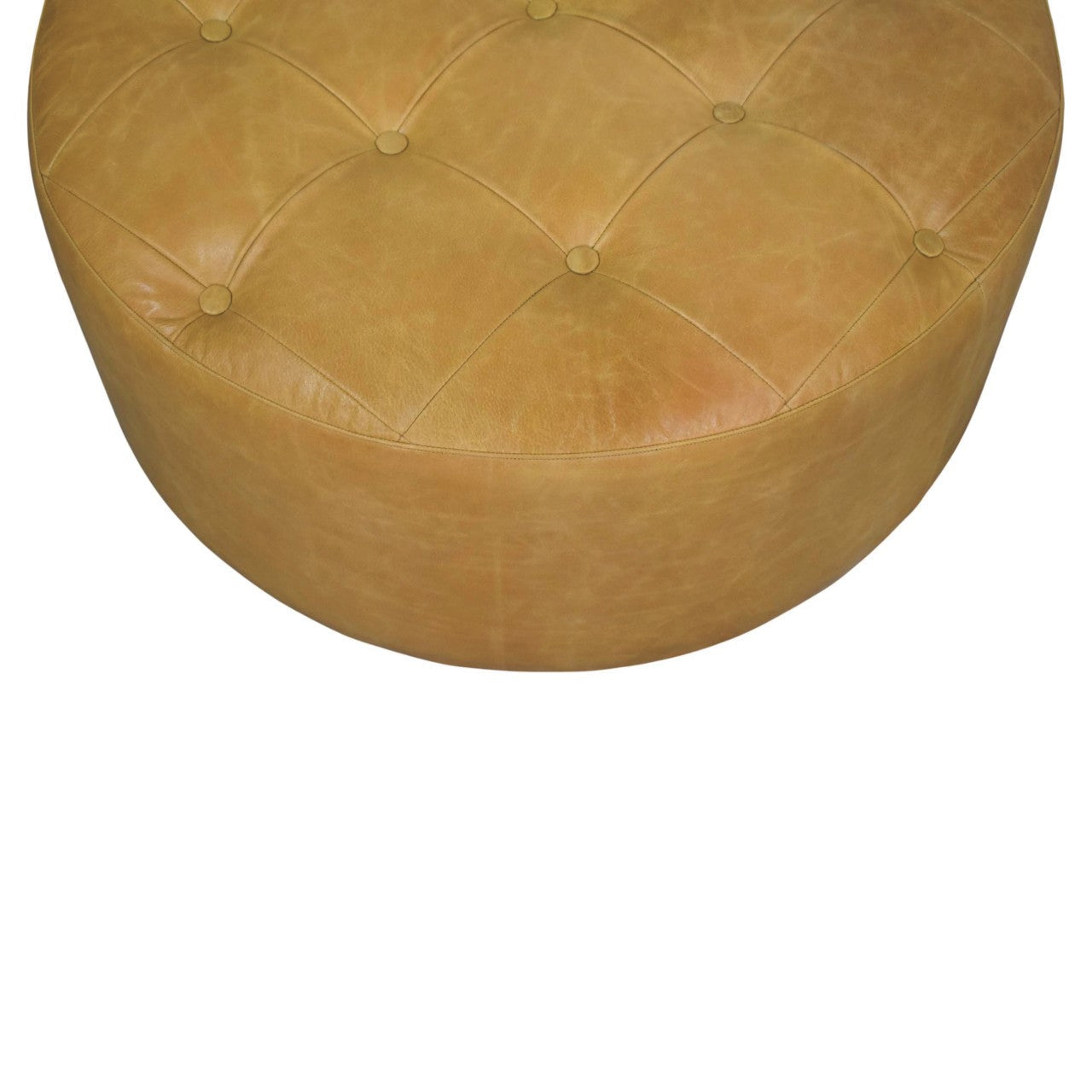Tan leather tufted ottoman with rounded cushioned top and button detailing for amber oak leather coffee table