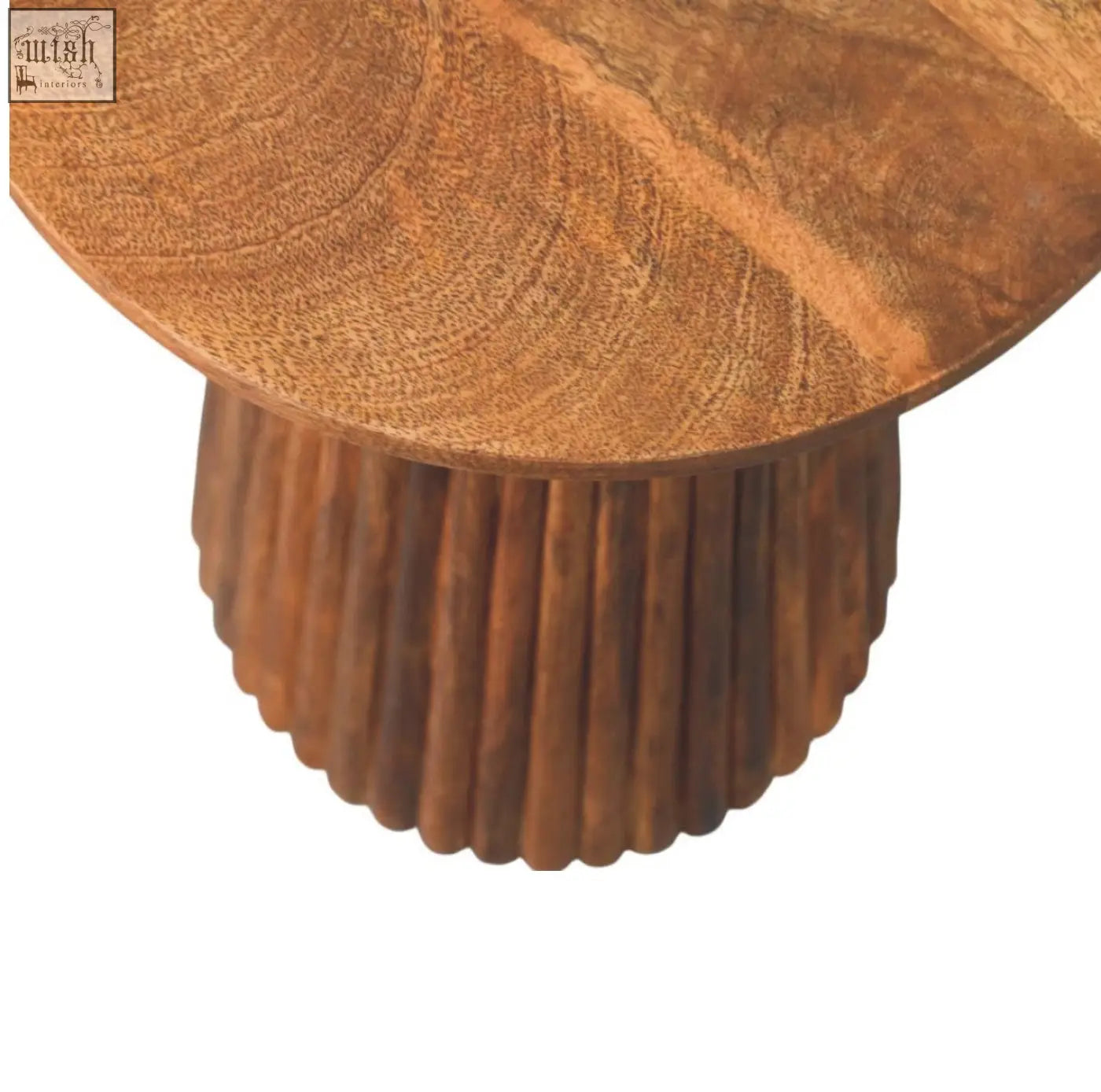 A rustic amber oak round side table with a circular wooden top and fluted ribbed base perfect for cozy spaces