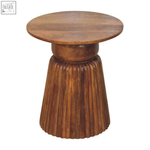 A rustic amber oak round side table with a wooden top and fluted ribbed base perfect for cozy spaces