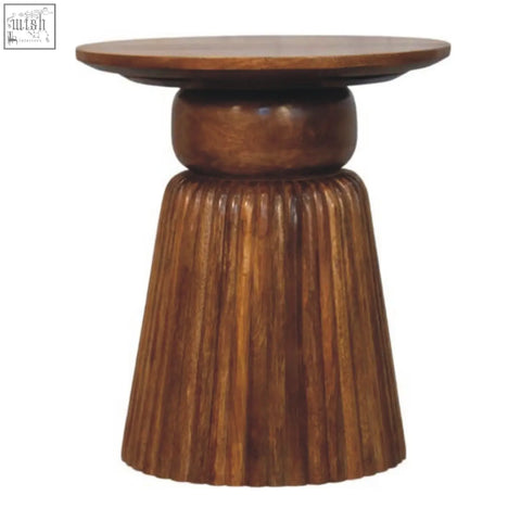 A rustic amber oak round side table with a smooth top and fluted tapered wooden base for cozy spaces