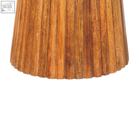 A warm amber oak round side table with a natural wood base featuring a fluted pleated design