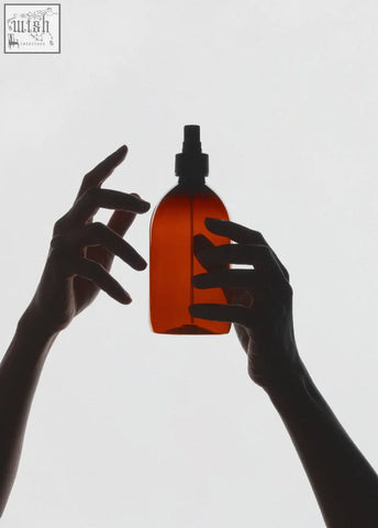 Amber plastic atomiser spray bottle in amber color with black nozzle made of plastic for easy spraying