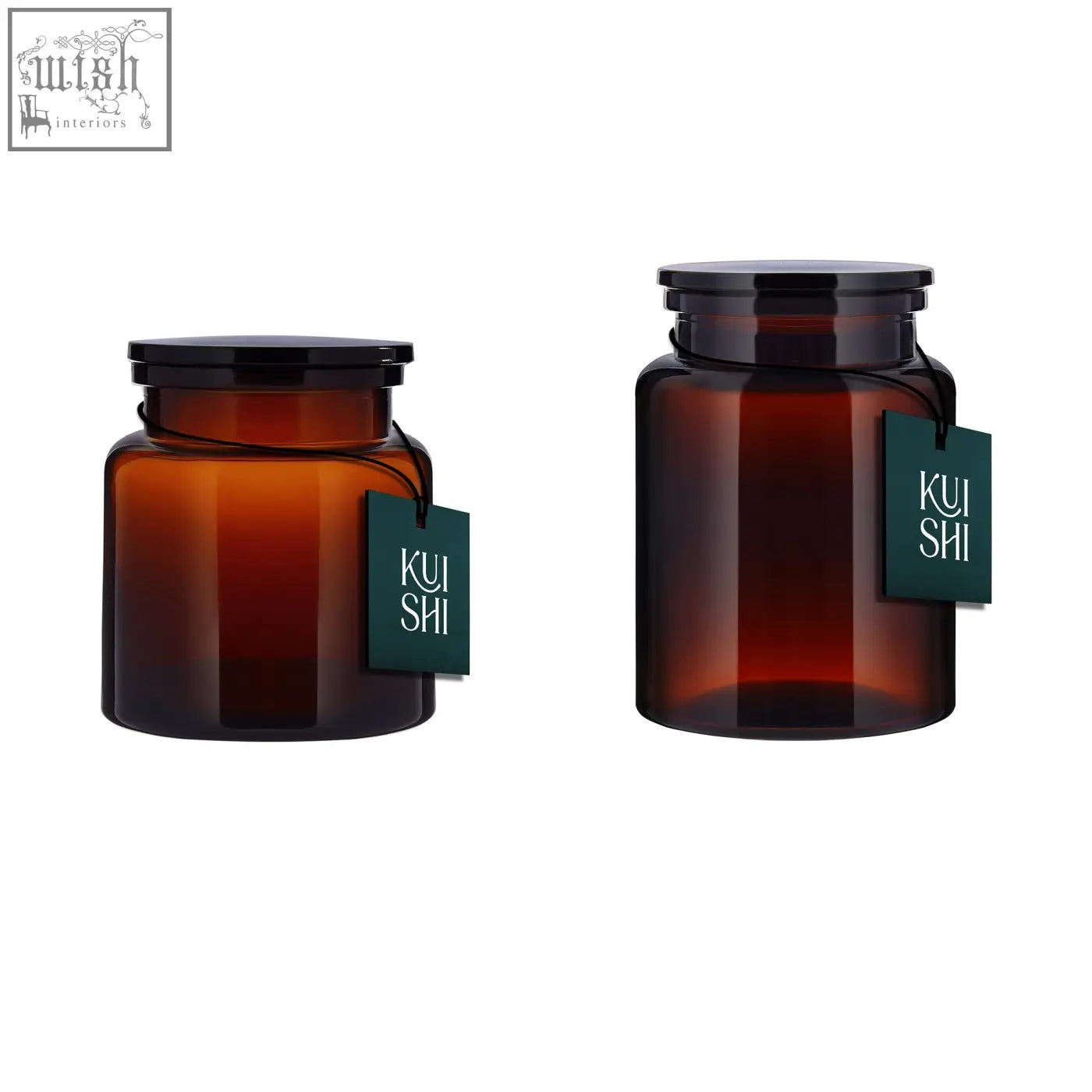 Two amber glass storage jars with black lids and green kui shi tags in a painted glass amber storage jar set