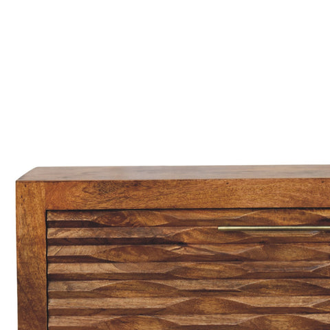A rustic wooden amber wavefront cabinet with a warm brown finish and distinctive wavy carved panels
