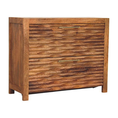 A rustic amber wavefront cabinet with two wooden drawers featuring a textured wavy pattern and brass handles