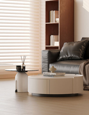 Cream-colored oval coffee table with sleek modern design and vertical grooves in the amelia coffee table set