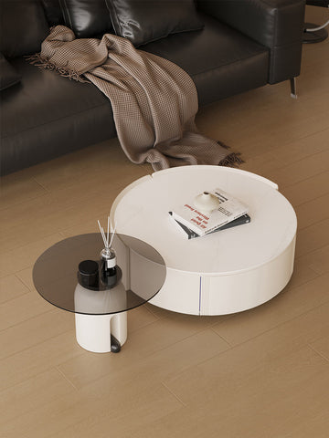 Modern white circular coffee table with subtle vertical grooves part of the amelia coffee table set
