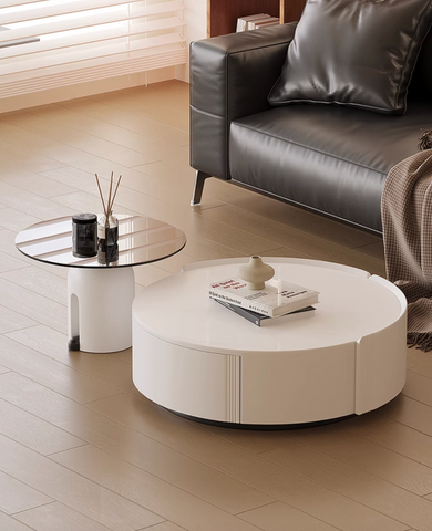 Amelia coffee table set featuring a modern white round coffee table with subtle vertical grooves and minimalist design