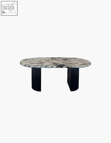 Elegant amina oval dining table with white gray marble top and sleek black ribbed solid wood legs