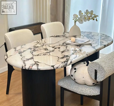 Elegant amina oval dining table with polished white and black marble top and sleek ribbed black solid wood legs
