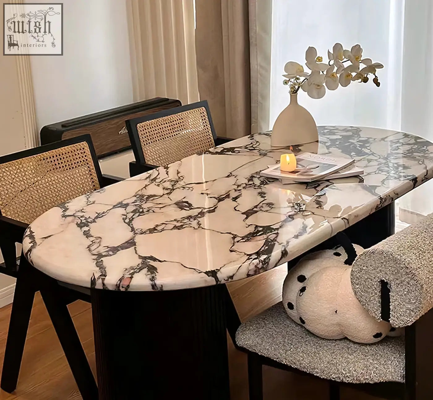 Elegant amina oval dining table with polished white and black marble top and sleek black solid wood legs