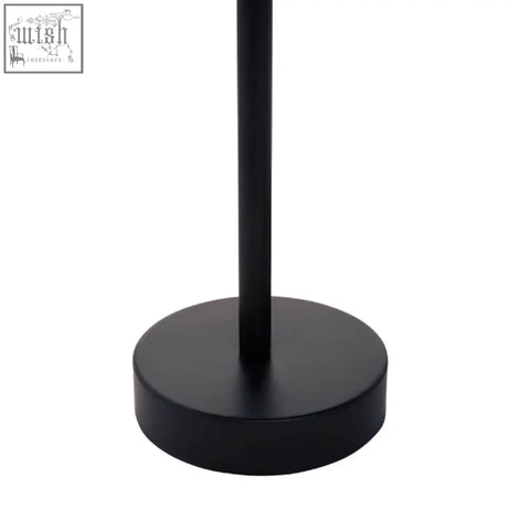 Black matte cylindrical stand with circular base from amira set of three gold and black tray tables