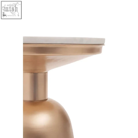 A sleek gold base side table with amira white marble top and smooth rounded metallic form
