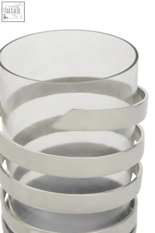 A sleek amreli small vertical textured silver metal hurricane candle holder with stacked polished silver rings and glass vase