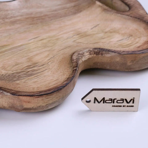 Handcrafted light brown mango wood serving dish with natural shape and visible wood grain for wood serving
