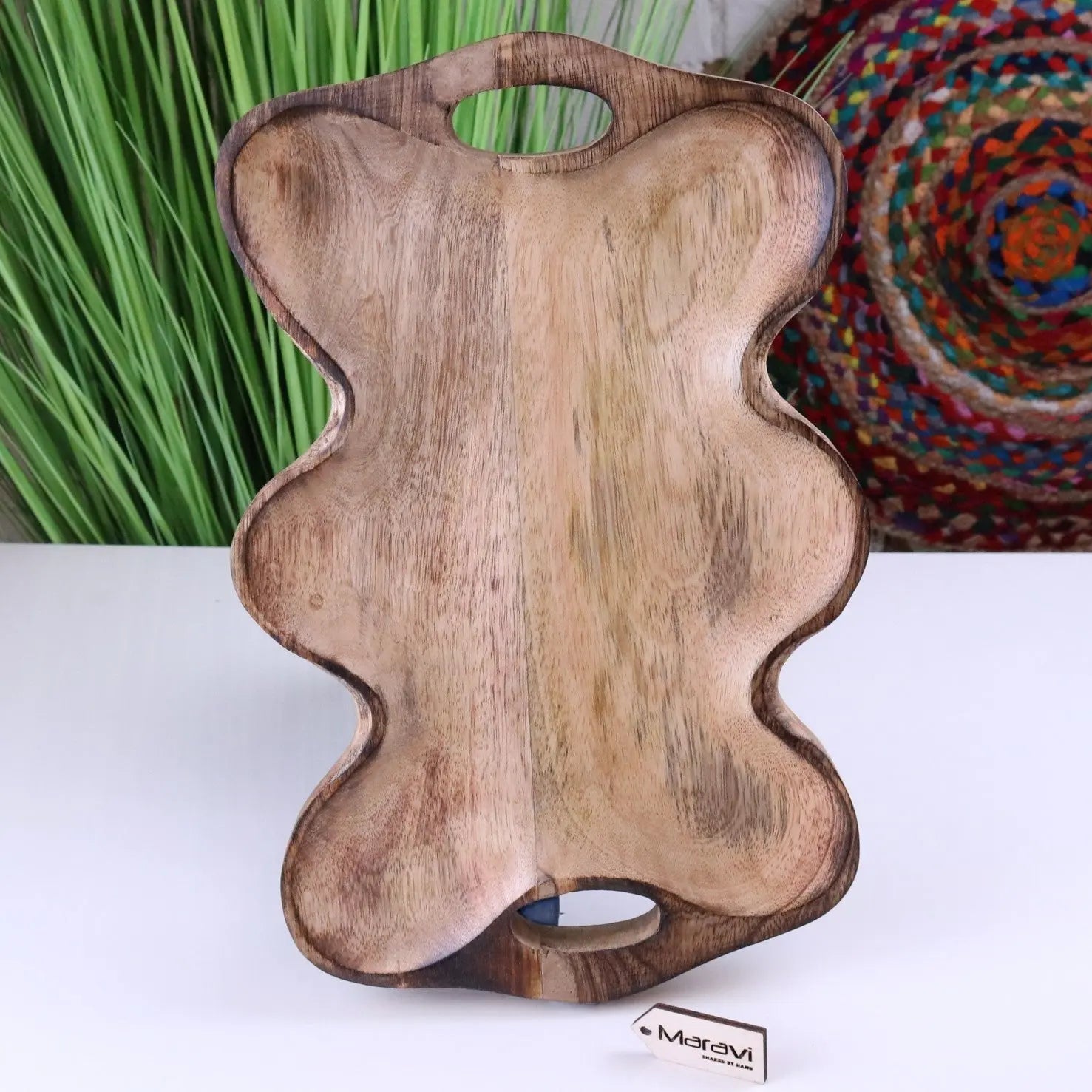 Handcrafted amrola mango wood serving dish shaped like a bear with natural wood grain and two cutout handles for easy wood serving