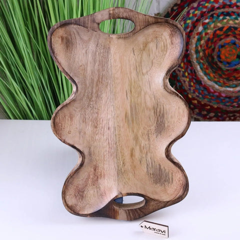 Handcrafted amrola mango wood serving dish shaped like a bear with natural wood grain and two cutout handles for easy wood serving
