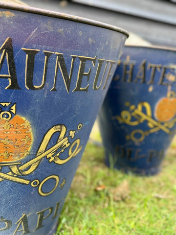 Vintage blue enamel french grape hod with gold lettering and ornate illustrations perfect for log basket planters