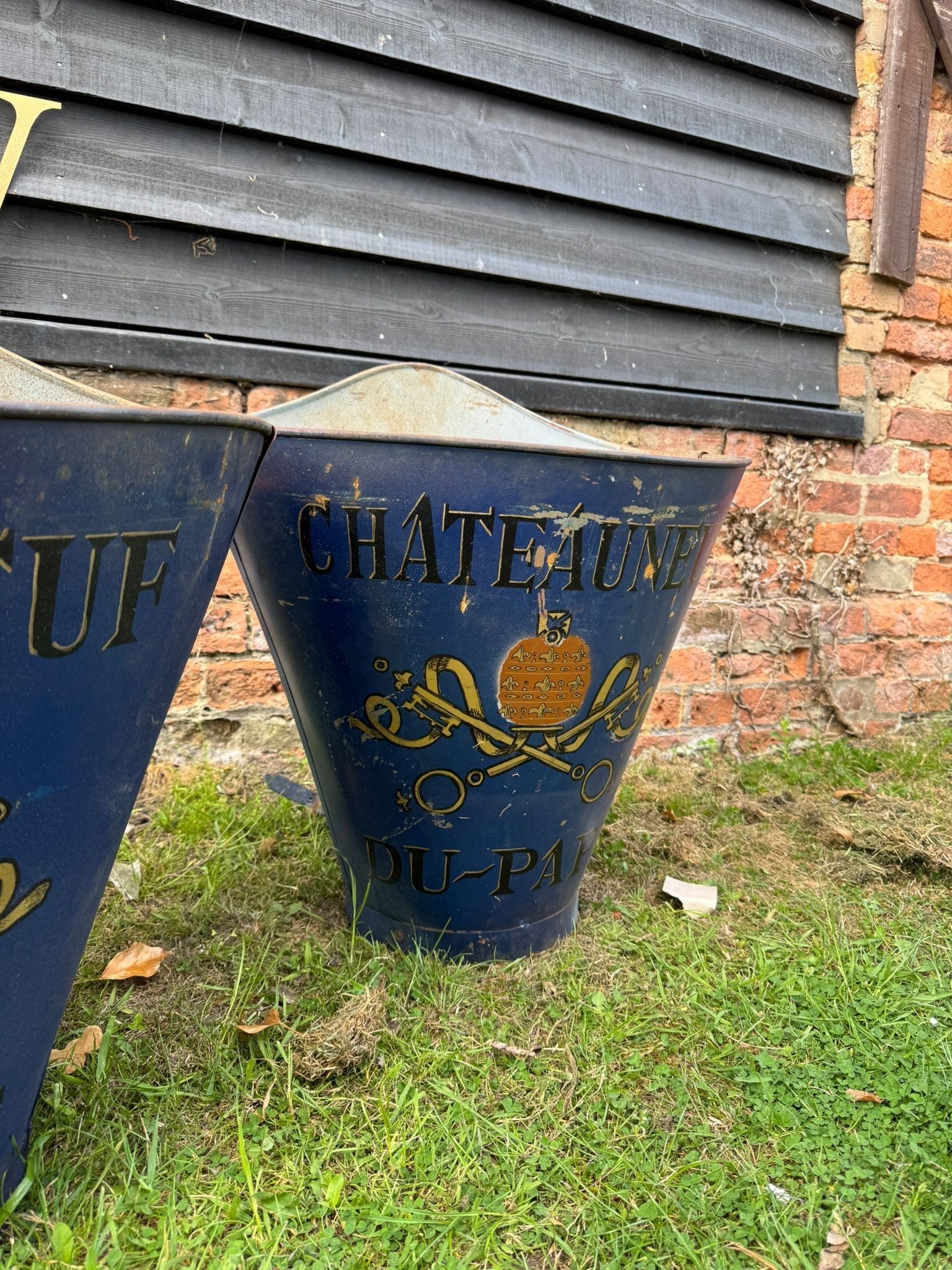 Deep blue metal wine barrel bucket with gold château du-pa lettering and emblem for vintage french grape hod planters