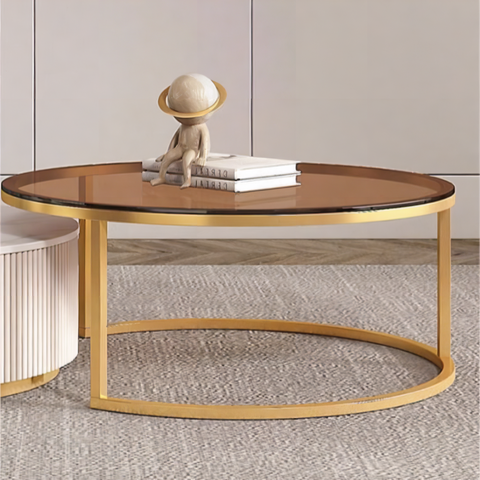 Gold-finished oval coffee table with glass top and curved metal legs featured with anastasia tv stand sintered stone
