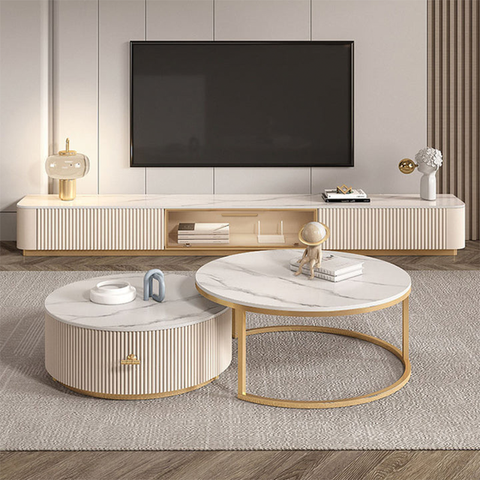 Modern round coffee table with white marble top and gold frame complementing anastasia tv stand sintered stone finish