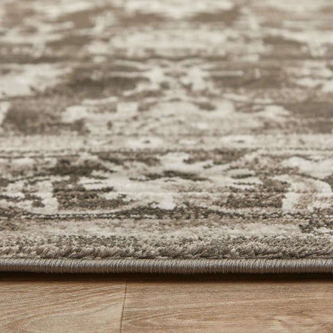 A textured anatolia dark grey vintage rug with a faded beige and grey patterned design perfect for cozy spaces