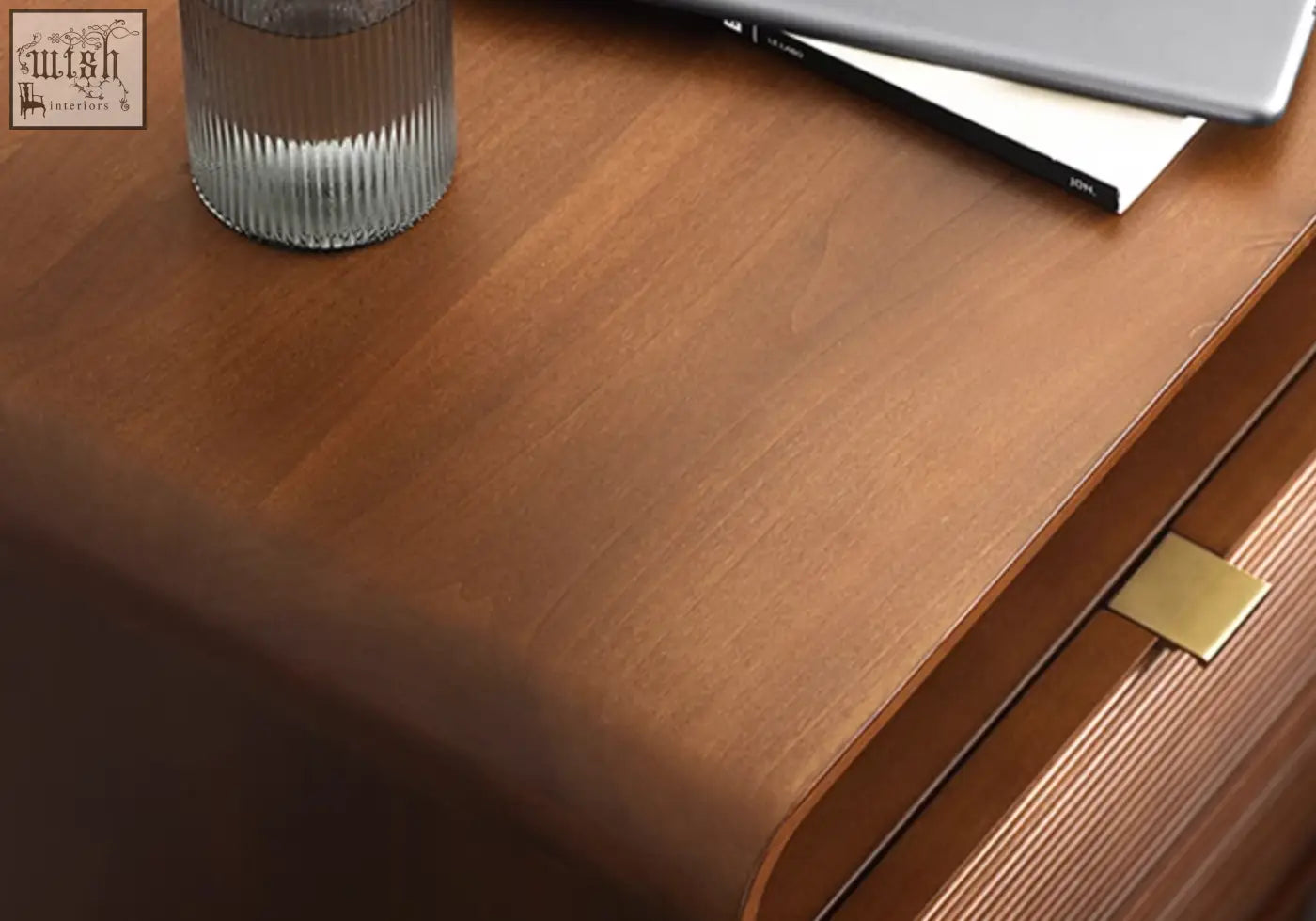 Warm-toned wooden andre bedside table with sleek curved design and polished brass drawer pull bedside table