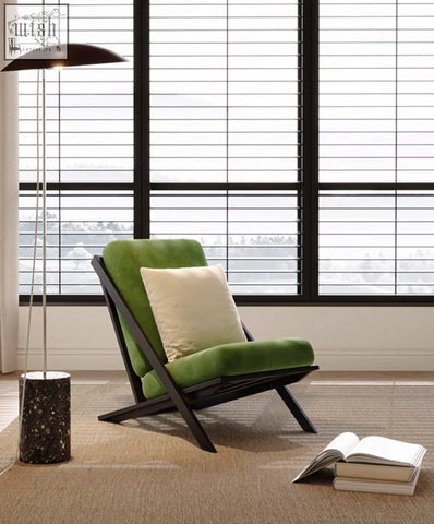 A modern andrea armchair velvet in green velvet with a black wooden frame and cream cushion with offer financing and shipping cost info