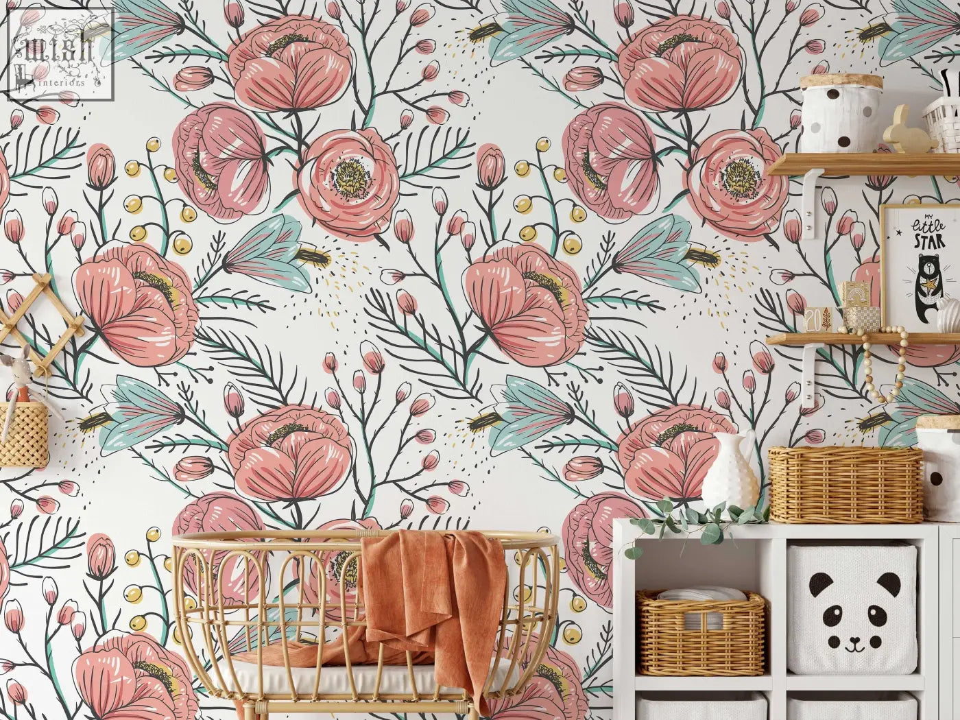 Wicker crib with rust-colored blanket beside pink poppy floral wall mural from anemone fall peel and stick wallpaper by contact clickwalls
