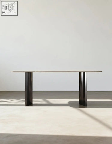 Minimalist angela marble dining table with sleek dark metal frame and long rectangular glass top for luxury dining