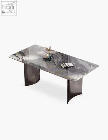 Modern rectangular angela marble dining table with sleek gray marble top and dark metallic curved legs for luxury dining