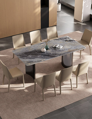 Angela dining table marble with sleek gray marble top and dark metal legs surrounded by beige chairs for luxury dining offers financing