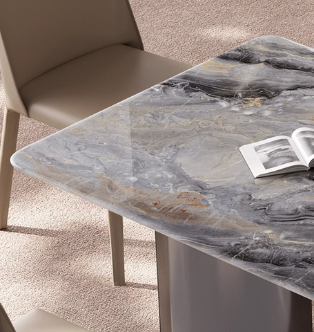 Sleek angela dining table with a polished gray marble top featuring black and gold veining for luxury dining offer financing