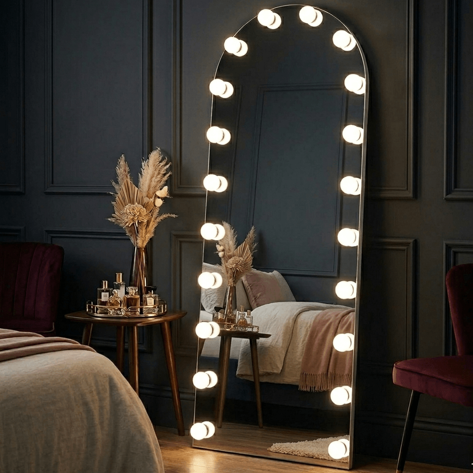Arched full length hollywood mirror with sleek metallic frame and bright bulbs from mirrors collection