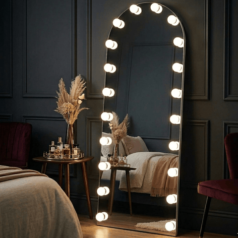 Arched full length hollywood mirror with sleek metallic frame and bright bulbs from mirrors collection