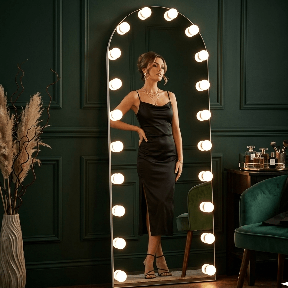 Black satin slip dress with high slit and thin straps shown in front of angelina full length arch hollywood mirror from mirrors collection