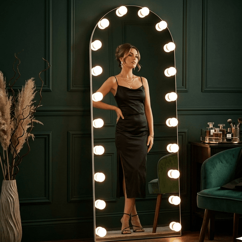 Black satin slip dress with high slit and thin straps shown in front of angelina full length arch hollywood mirror from mirrors collection