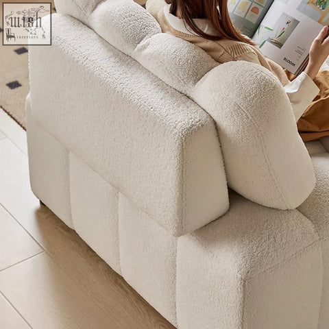 Cream-colored plush shearling anika armchair single sofa bed with modern blocky design and segmented backrest