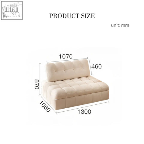 Cream-colored tufted fabric anika armchair single sofa bed with cushioned backrest and modern minimalist design