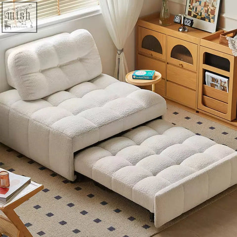 Cream-colored anika armchair single sofa bed with plush tufted texture and extended mattress section for comfort