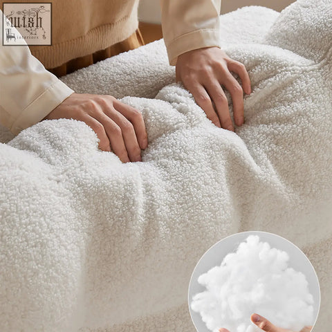 White plush fleece blanket with soft fluffy texture on anika armchair single sofa bed for cozy comfort